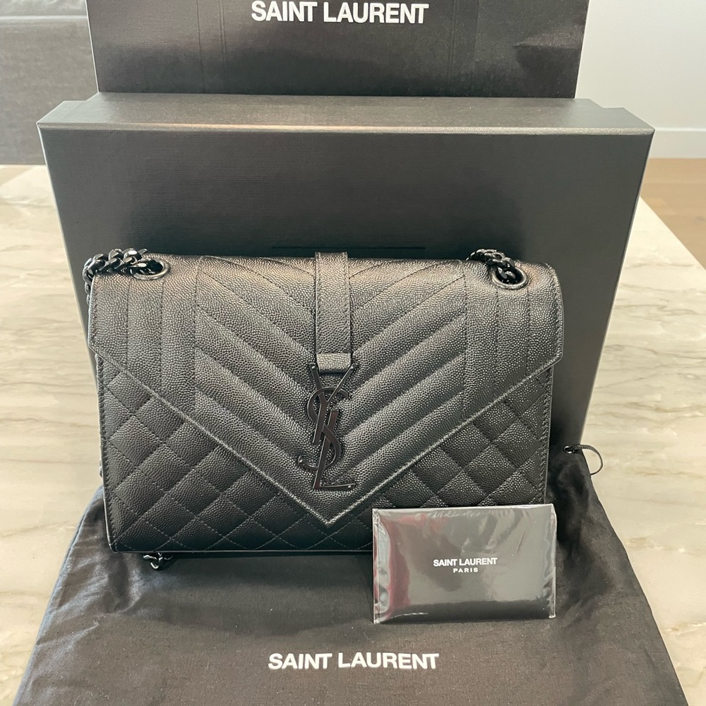 Brand new YSL Medium matelasse purse with box, dust bag, and card. Never used.